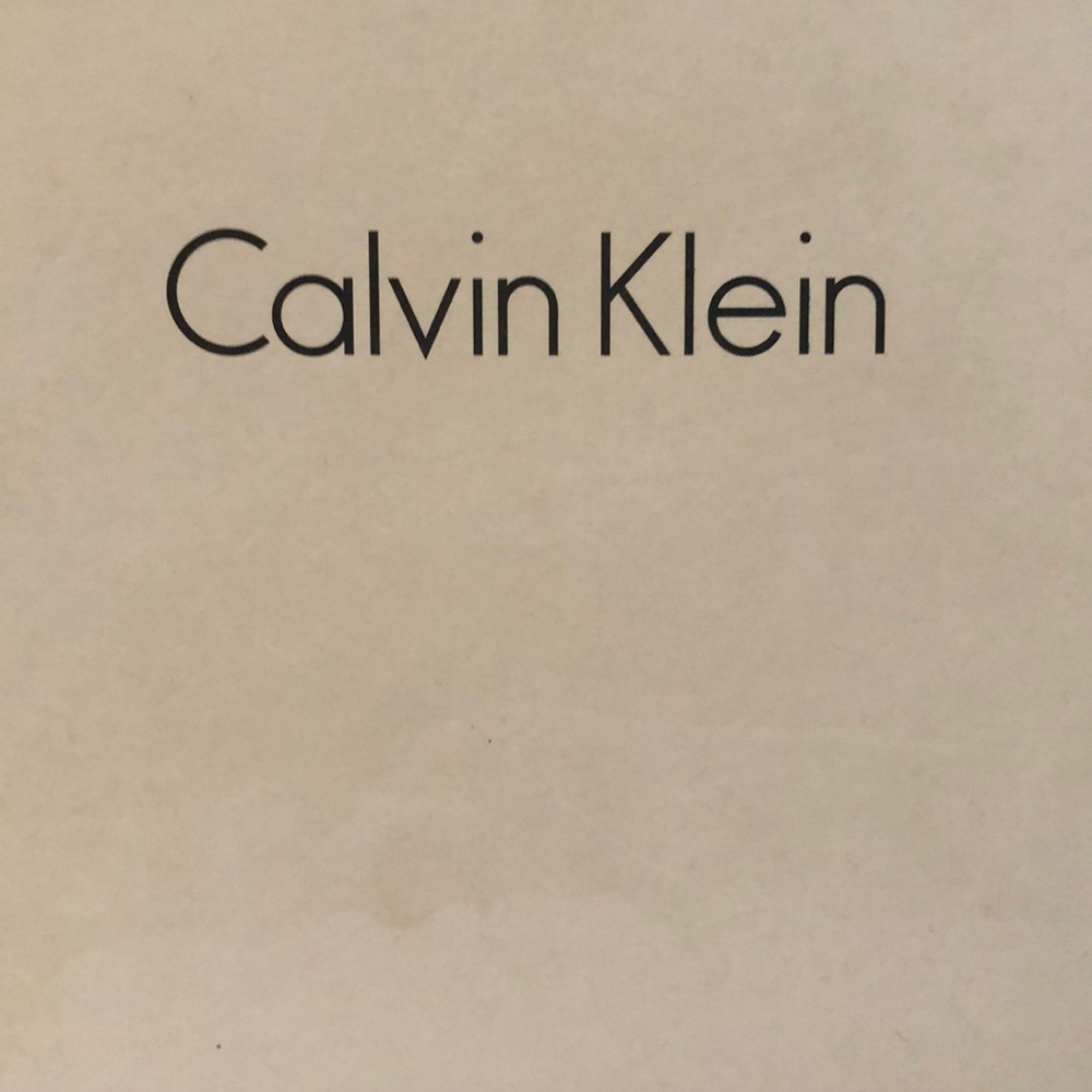 Calvin Klein snake color heels. About an inch platform. NEVER WORN